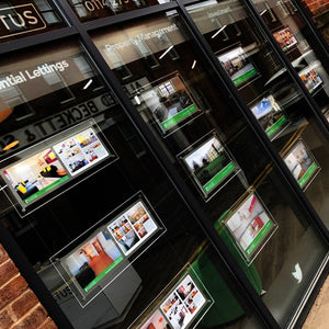 Illuminated estate agent window display