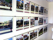 acrylic display pockets and leaflet dispensers that hook on wall mounted rods